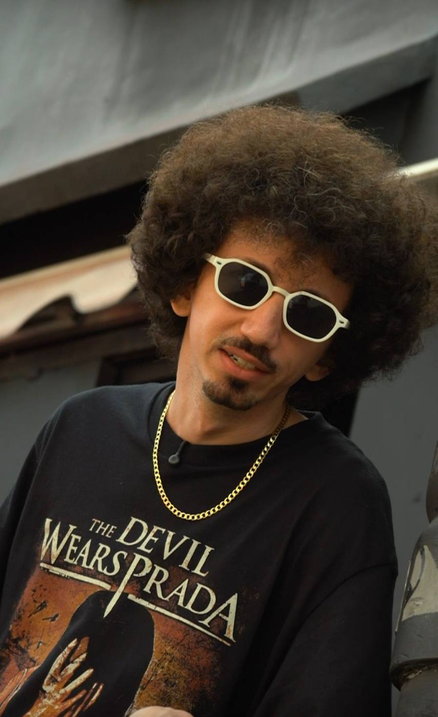 Portrait of Bencore wearing white sunglasses