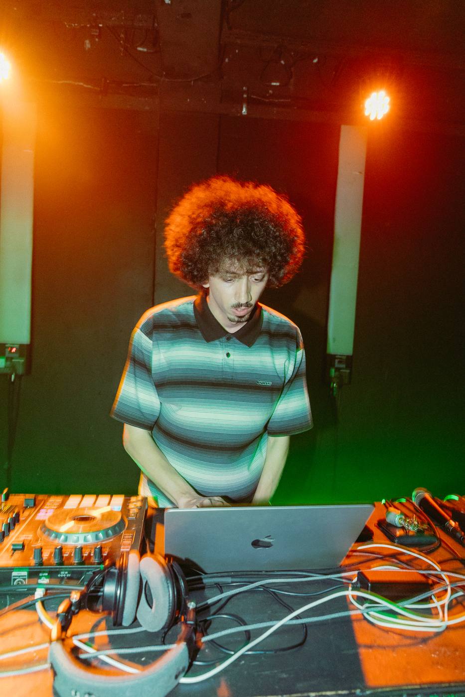 Bencore performing at the decks under amber light